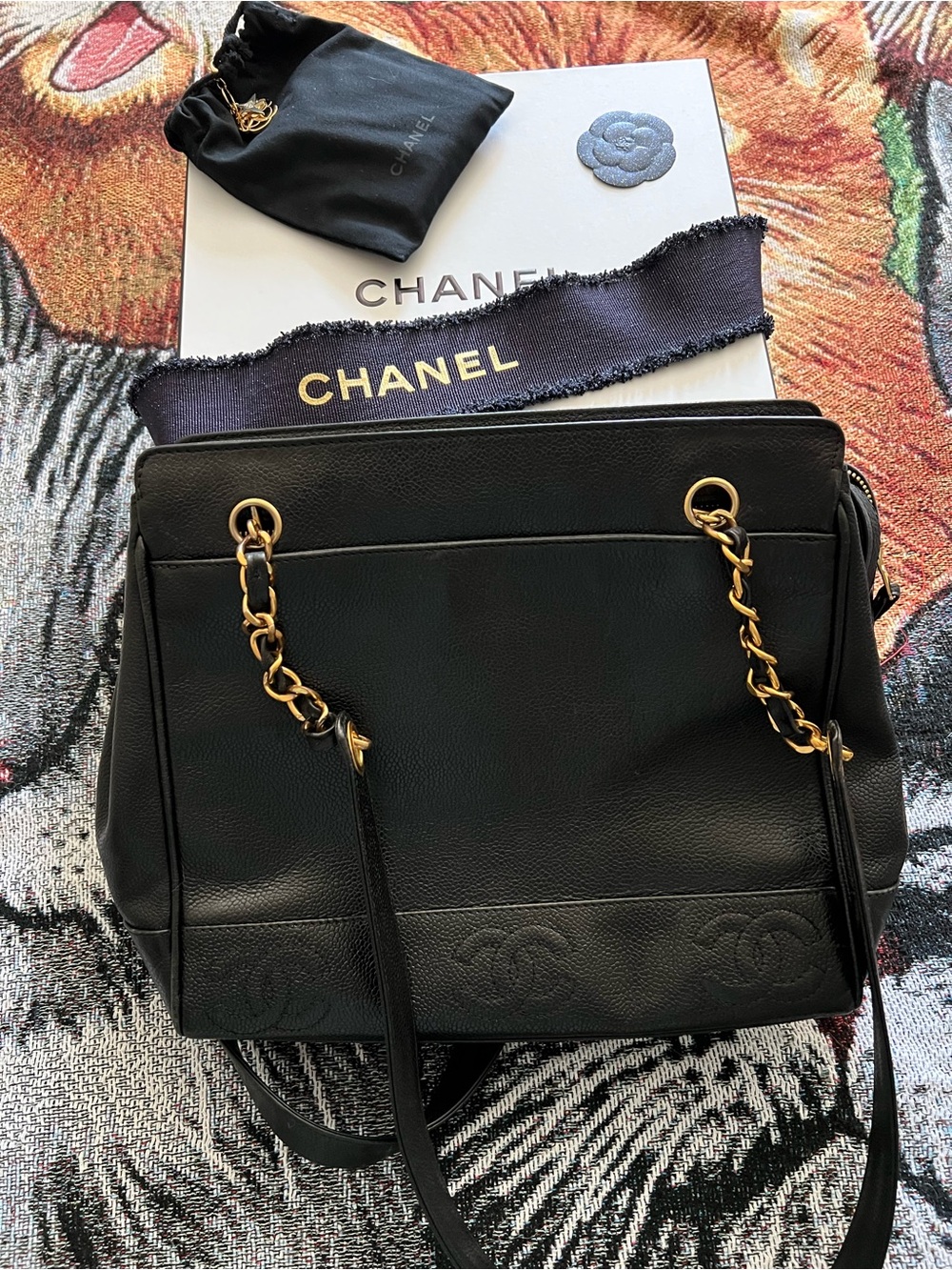 CHANEL Black Leather Shoulder Bag with Gold Chain Accents